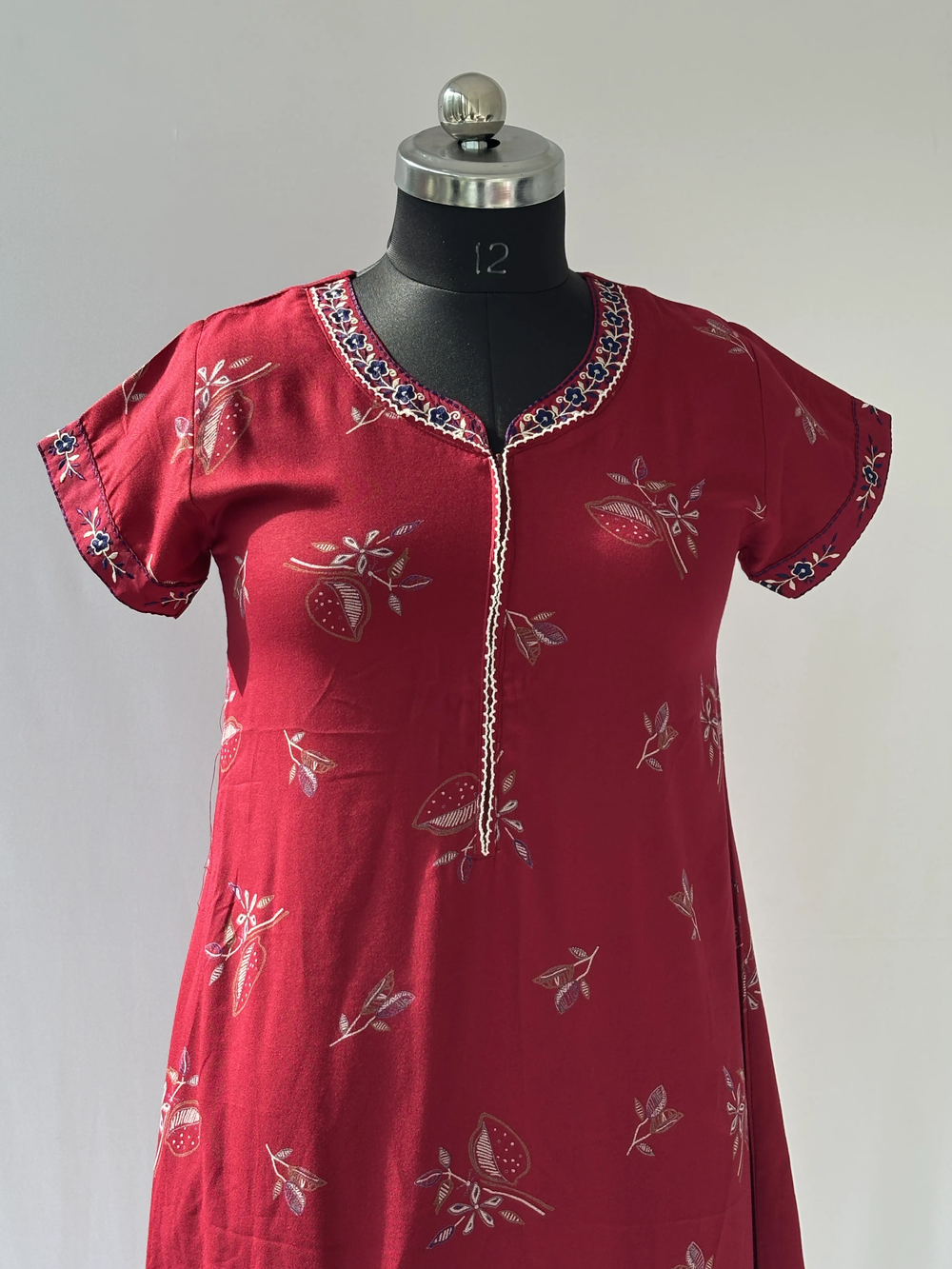 Maroon floral designer nighty for ladies featuring a premium posy print.